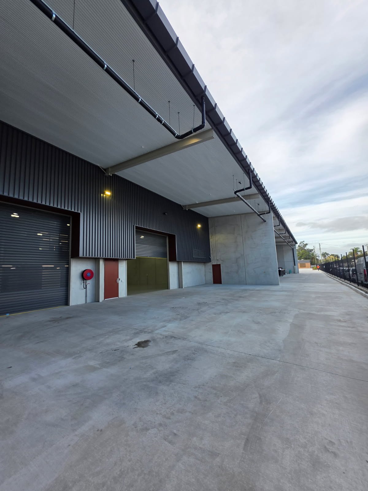 Fire hose reel installed on an industrial building serviced by Safe QLD